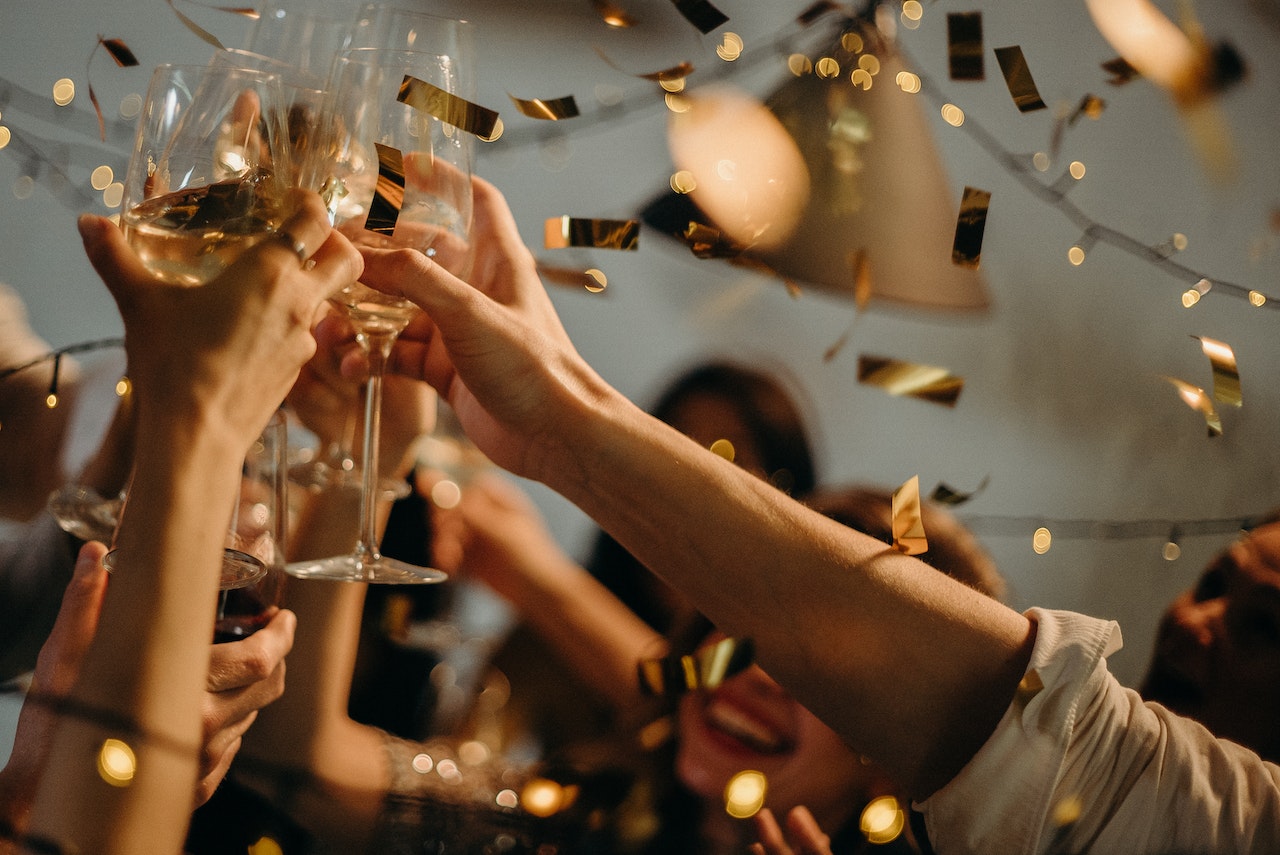 People toast drinks at Halloween party